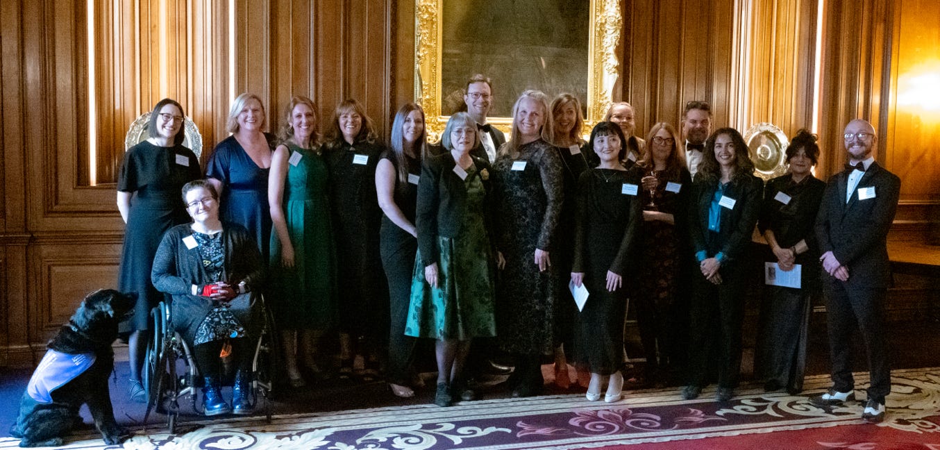 At the awards dinner a winner of an Educatprs Trust award receives from the master a  trophy and certificate at the awards dinner along with their cheque.