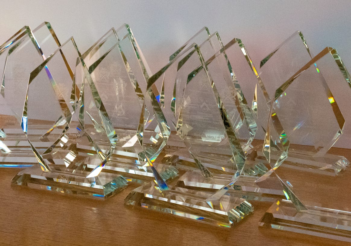 the trophy and certificate that Educatprs Trust awards receive at an awards dinner along  with their cheque.